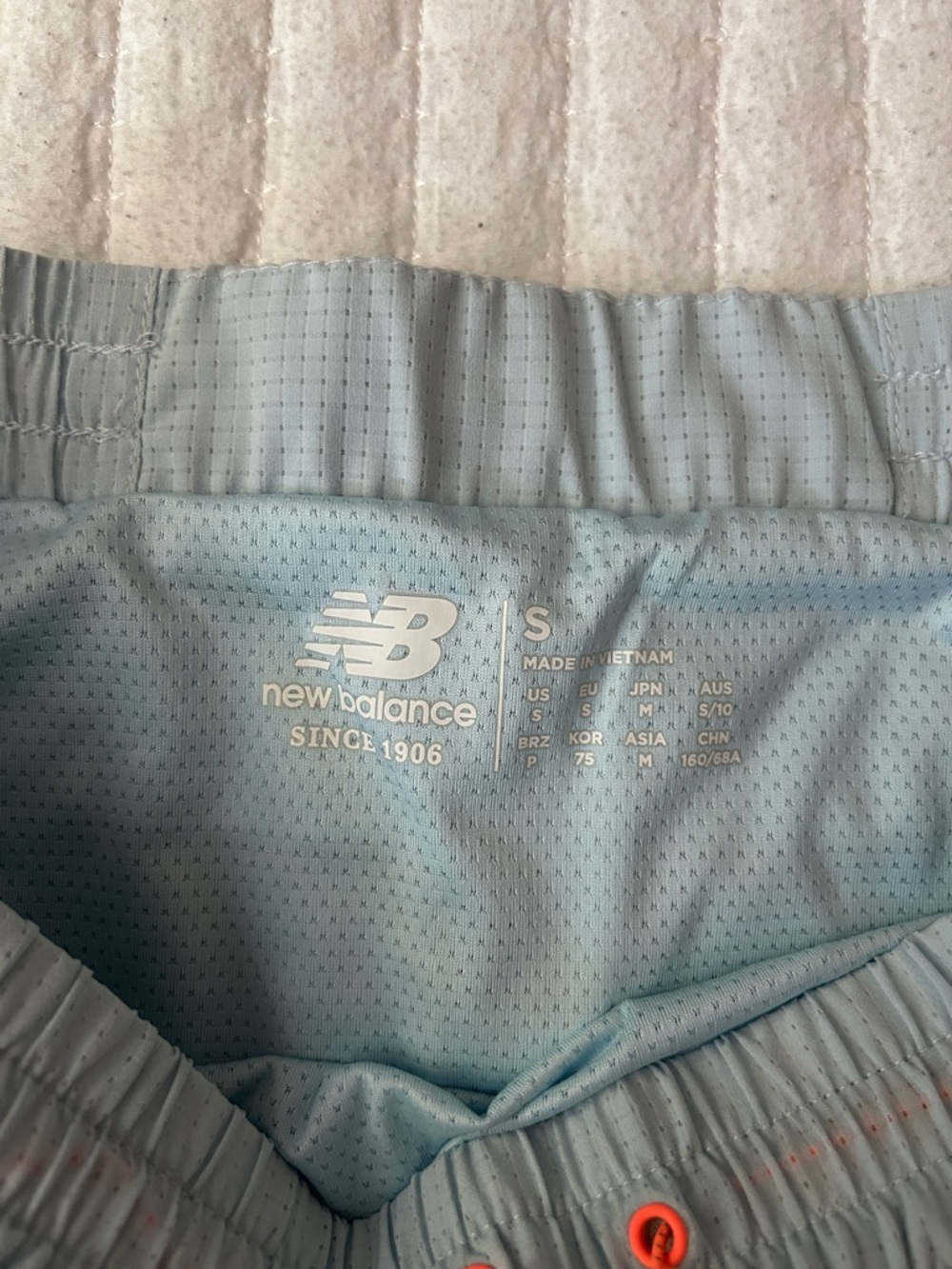 New Balance Light Blue Mesh Running Shorts with Orange Eyelets - Picture 2 of 8